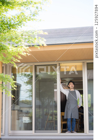 A bearded man looking out the window. Image of lifestyle, second life, semi-retirement A bearded man looking out the window. Image of lifestyle, second life, semi-retirement 125927894