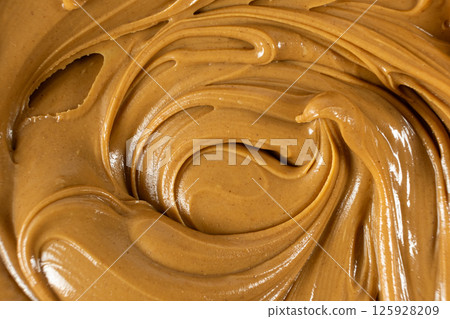 Smooth Nut Butter Swirl as Culinary Background 125928209