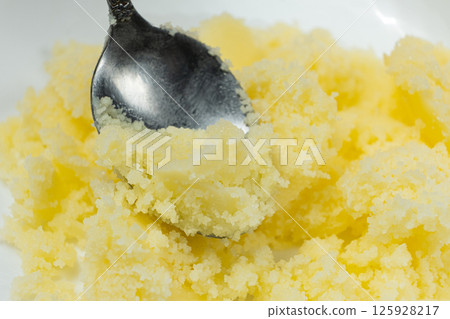 Natural Indian Traditional Ghee Butter Clarified Butter In Spoon Close-Up 125928217