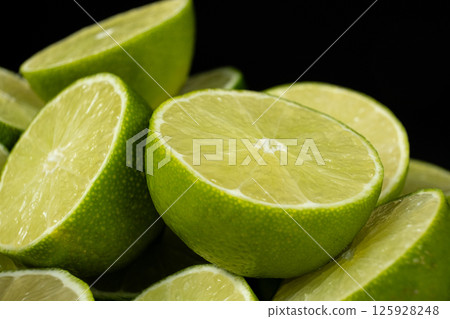 Juicy Green Lime Halves in Macro View Juicy Green Lime Halves in Macro View 125928248