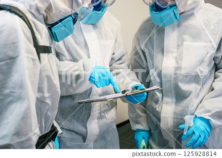 Cleaning contractors having a meeting before work begins Cleaning contractors having a meeting before work begins 125928814