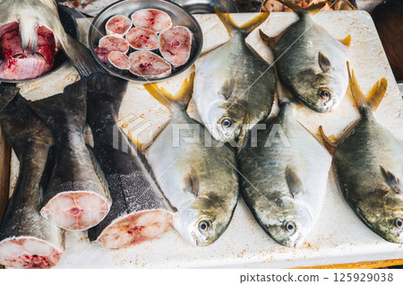 assortment of fresh fish catch on the counter at Asian seafood market in Vietnam assortment of fresh fish catch on the counter at Asian seafood market in Vietnam 125929038