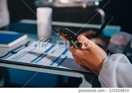 Male and female doctors are having a meeting in a hospital room. 125929614