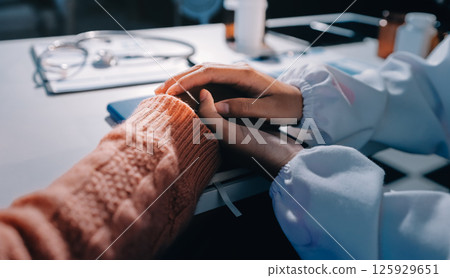Asian female hands touching old female hand Helping hands take care of the elderly concept in hospital. Asian female hands touching old female hand Helping hands take care of the elderly concept in hospital. 125929651