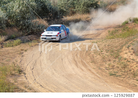 Rally Car Enters a Turn 125929887