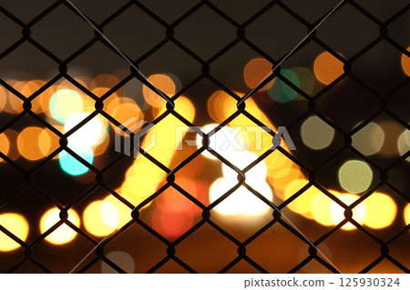 Night view through the fence 125930324