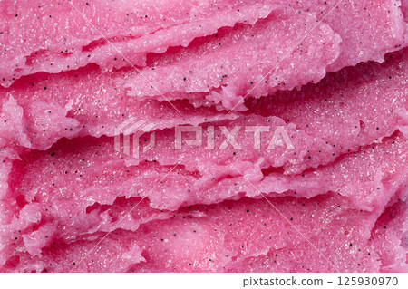 Texture of pink raspberry scrub. Fruit exfoliation scrubber for body and face in SPA. Body care scrub background for design. Texture of pink raspberry scrub. Fruit exfoliation scrubber for body and face in SPA. Body care scrub background for design. 125930970