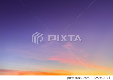 Purple sunrise sky background. Sky with orange golden sunrise clouds. Nature sky background for design. 125930971