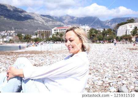 mature woman working outside in caffe on beach coast, lifestyle people concept mature woman working outside in caffe on beach coast, lifestyle people concept 125931510