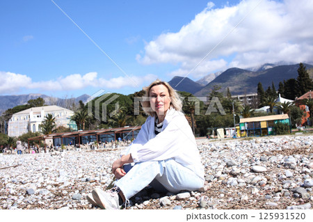 mature woman working outside in caffe on beach coast, lifestyle people concept 125931520