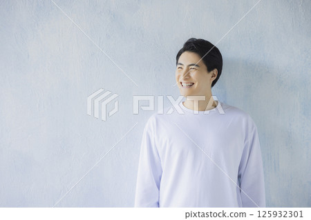 A man wearing a T-shirt A man wearing a T-shirt 125932301