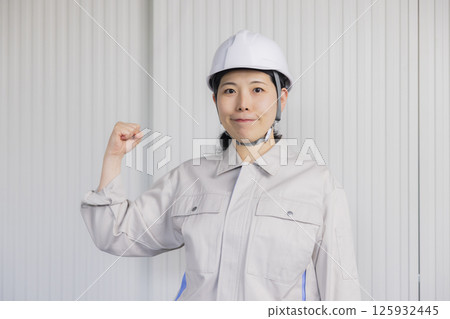 Middle-aged woman wearing work clothes 125932445