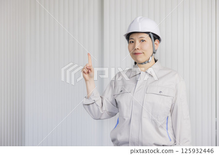 Middle-aged woman wearing work clothes 125932446