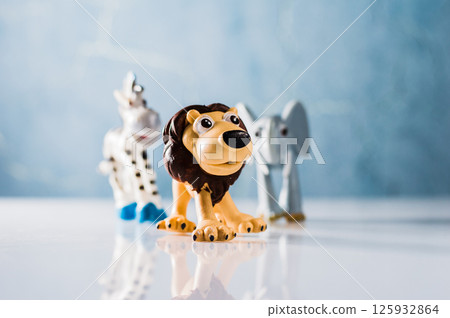 Plastic toys: zebra, lion and elephant. Figures of safari animals. 125932864