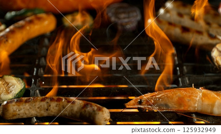 Close-up of Barbeque Grill with Various Meats and Roaring Flames Close-up of Barbeque Grill with Various Meats and Roaring Flames 125932949