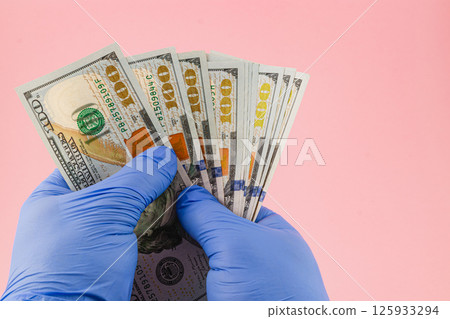 Foot care procedure with medical gloves on patients toes Foot care procedure with medical gloves on patients toes 125933294