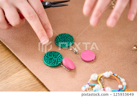 A woman making handmade accessories: rings 125933649