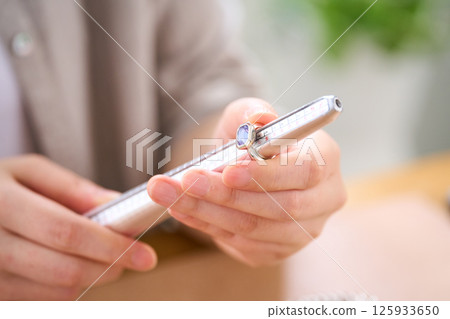 Woman making accessories, ring, ring gauge Woman making accessories, ring, ring gauge 125933650