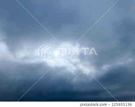 A heavy overcast sky and a pale light A heavy overcast sky and a pale light 125935136