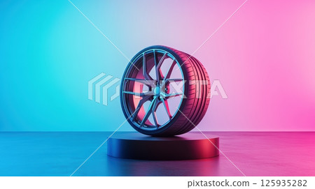 Sleek alloy wheel displayed on a pedestal against a vibrant gradient blue and pink background enhancing modern automotive aesthetics. Tires with rubber tread on alloy wheels 125935282