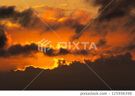 Sky with Colorful Pink Golden and Dark Clouds at Sunset. Abstract Texture Background Sky with Colorful Pink Golden and Dark Clouds at Sunset. Abstract Texture Background 125936398