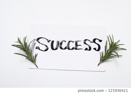 A card with the word "Success" written in English and herbs A card with the word "Success" written in English and herbs 125936421