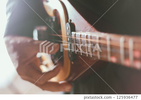 Close up hand playing Thai Mandolin Close up hand playing Thai Mandolin 125936477