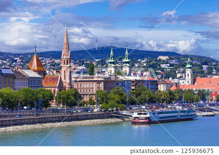 Beautiful capital of Hungary - Budapest. View of downtown and Danube river with ferry boats. Beautiful capital of Hungary - Budapest. View of downtown and Danube river with ferry boats. 125936675