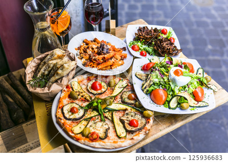 Travel in Italy, Part of Italian culture - healthy mediterranean italian food. Rome street restaurants Travel in Italy, Part of Italian culture - healthy mediterranean italian food. Rome street restaurants 125936683