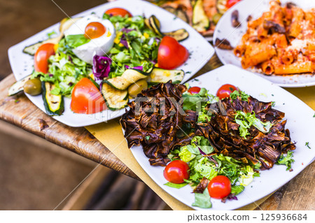 Travel in Italy, Part of Italian culture - healthy mediterranean italian food. Rome street restaurants Travel in Italy, Part of Italian culture - healthy mediterranean italian food. Rome street restaurants 125936684