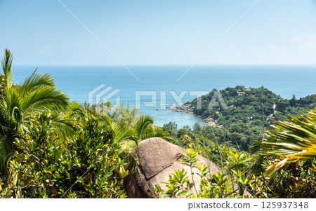 Scenic midday view from a tropical hilltop on Praslin Island, Seychelles Scenic midday view from a tropical hilltop on Praslin Island, Seychelles 125937348
