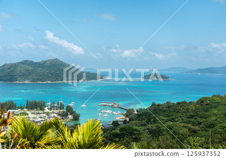 Scenic midday view from a tropical hilltop on Praslin Island, Seychelles Scenic midday view from a tropical hilltop on Praslin Island, Seychelles 125937352