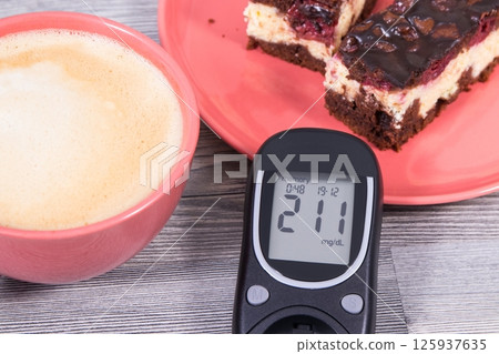 Glucometer for measuring sugar level, cheesecake Glucometer for measuring sugar level, cheesecake 125937635