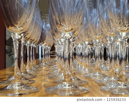 Empty glasses of champagne on the bar table in the reataurant. Empty glasses of champagne on the bar table in the reataurant. 125938233