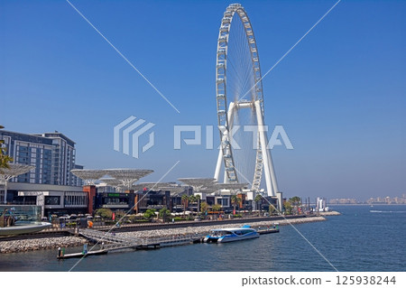 Dubai Eye giant Ferris wheel under blue sky Dubai Eye giant Ferris wheel under blue sky 125938244