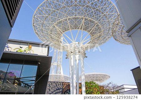 Modern umbrella like steel structures under blue sky in Dubai 125938274