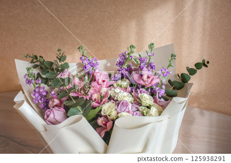 A large colorful delicate bouquet in a gift box with a copy space. A large colorful delicate bouquet in a gift box with a copy space. 125938291