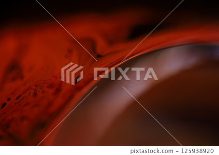 Red reflections of liquid in macro, red liquid surface, bubbles in macro, connection of bubbles in macro, cell from liquid, horror background, glossy surface panels Red reflections of liquid in macro, red liquid surface, bubbles in macro, connection of bubbles in macro, cell from liquid, horror background, glossy surface panels 125938920