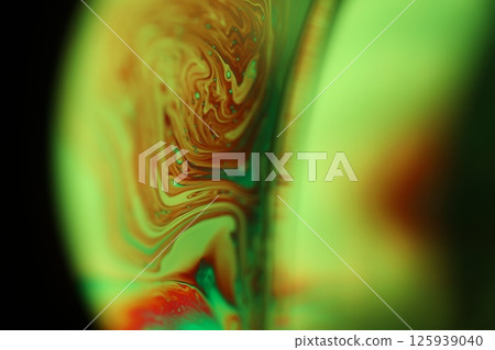 Green liquid surface on dark background, green Reflections of liquid in macro, green liquid surface, bubbles in macro, connection of bubbles in macro, cell from liquid, dark background, glossy surface Green liquid surface on dark background, green Reflections of liquid in macro, green liquid surface, bubbles in macro, connection of bubbles in macro, cell from liquid, dark background, glossy surface 125939040
