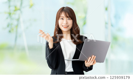 Woman with a laptop / business woman Woman with a laptop / business woman 125939179