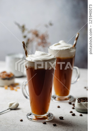 Iced coffee in a tall glass 125940073