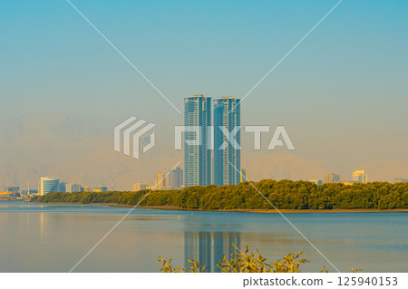 Ras al Khaimah city view, Palm-lined walkway Ras al Khaimah city view, Palm-lined walkway 125940153
