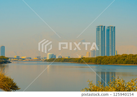 Ras al Khaimah city view, Palm-lined walkway 125940154