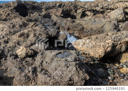 Hole in the coastal rocks, Telde, Gran Canaria 125940191
