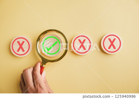 Business choices, man holds magnifying glass considering yes or no. Red question mark hints at difficulty. Hand selects right option. Communication of decision made. Think With Yes Or No Choice. Business choices, man holds magnifying glass considering yes or no. Red question mark hints at difficulty. Hand selects right option. Communication of decision made. Think With Yes Or No Choice. 125940996
