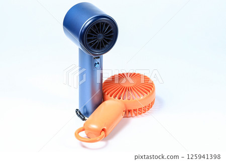 Small plastic Portable fan side view, isolated on white background. 125941398