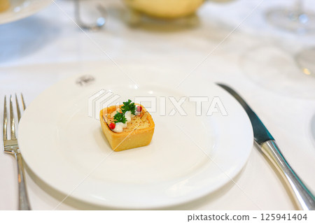 Dessert, cake, canape, macarons and sweets to accompany afternoon tea. 125941404