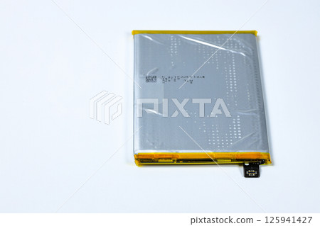 damaged swollen Lithium polymer, Li-ion batteries for mobile device isolated on white background. 125941427