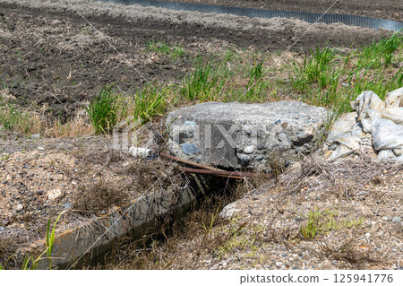 Remains of concrete thought to have been used on the runway at the former Japanese military's Yanagimoto Airfield Remains of concrete thought to have been used on the runway at the former Japanese military's Yanagimoto Airfield 125941776