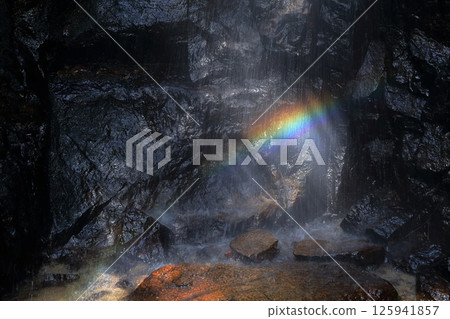 A rainbow shining in the waterfall basin 125941857